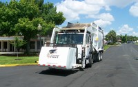 photo of waste vehicle for picking up solid waste